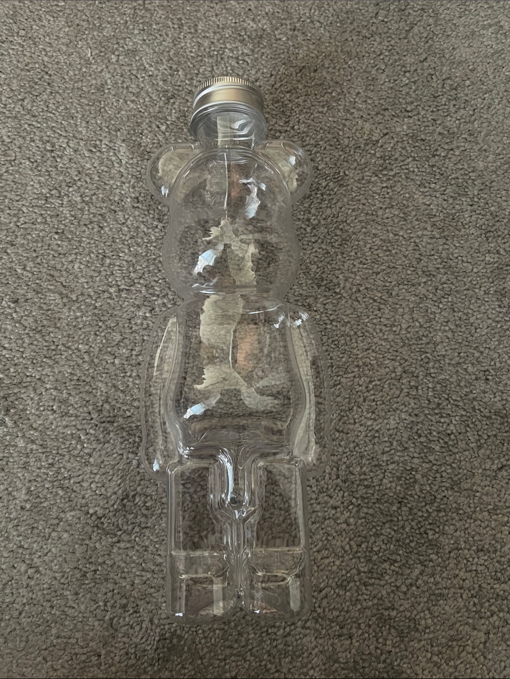 Clear bear-shape plastic bottle